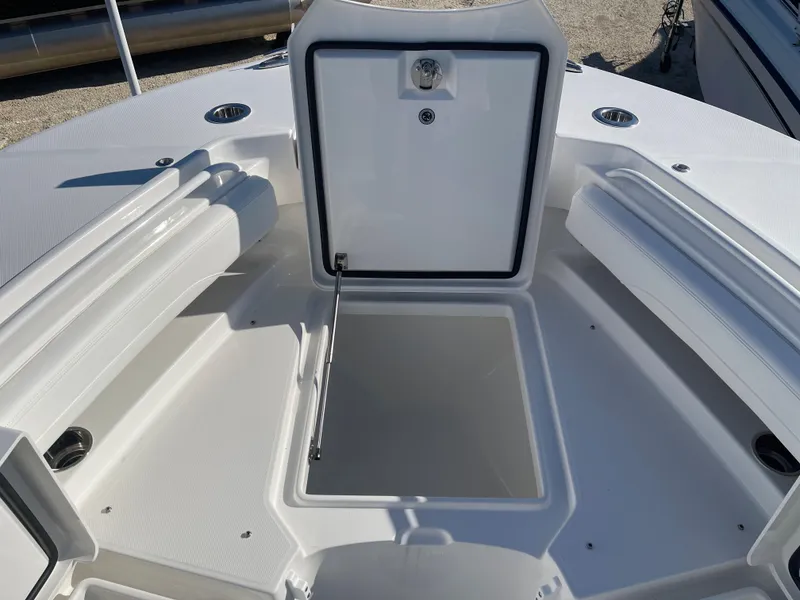 Slide: The Image of 2022 Regulator 28 boat with open storage compartment on deck. - 10