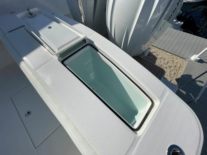 Slide: The Image of 2022 Regulator 28 boat with a sleek, modern livewell design on deck. - 23
