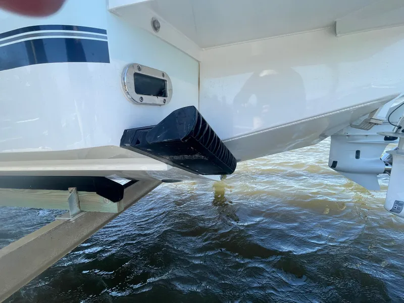 Slide: The Image of 2022 Regulator 28 boat hull detail with water backdrop. - 26