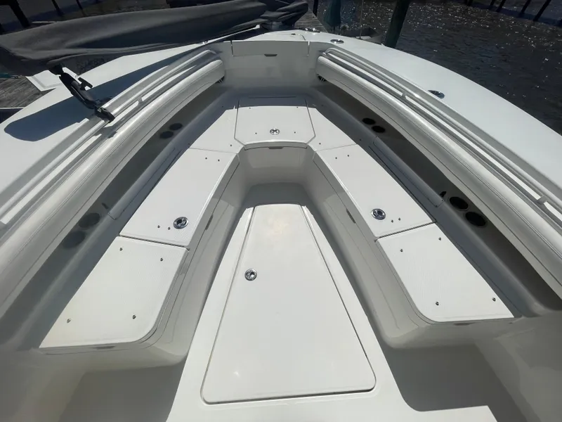 Slide: The Image of 2022 Regulator 28 boat interior with spacious seating and storage compartments. - 28