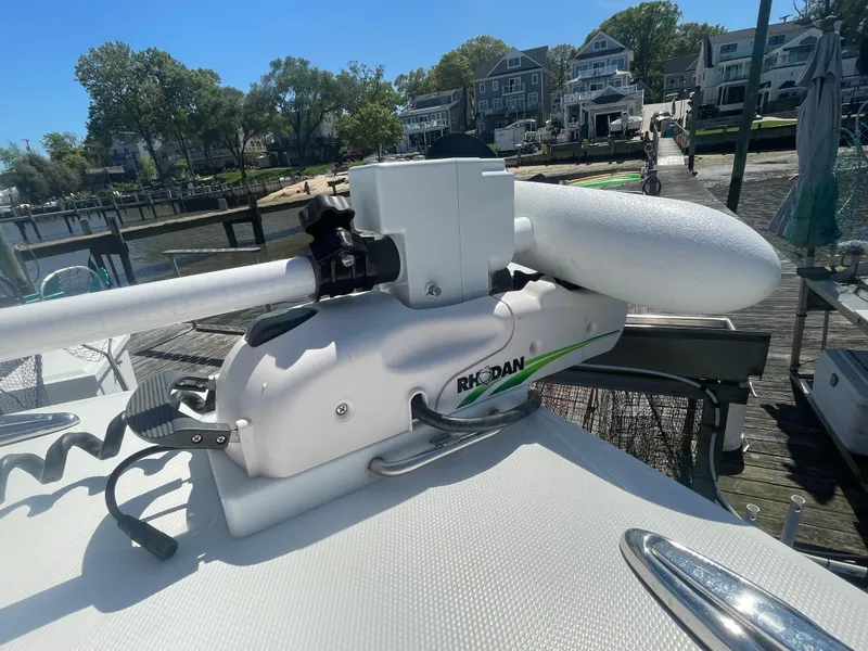 Slide: The Image of 2022 Regulator 28 boat with a Rhodan trolling motor at a dock. - 40