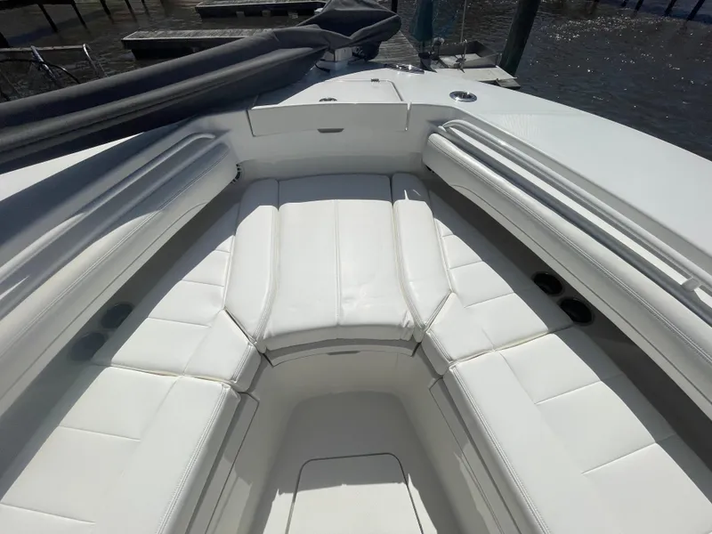Slide: The Image of 2022 Regulator 28 boat with spacious white seating area. - 47