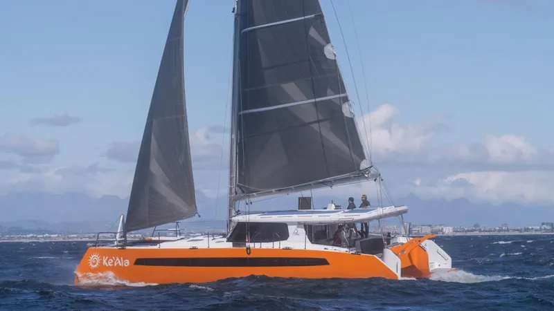 The Image of Sailing catamaran Balance 482, 2021 model, on open sea under clear blue sky. - 0