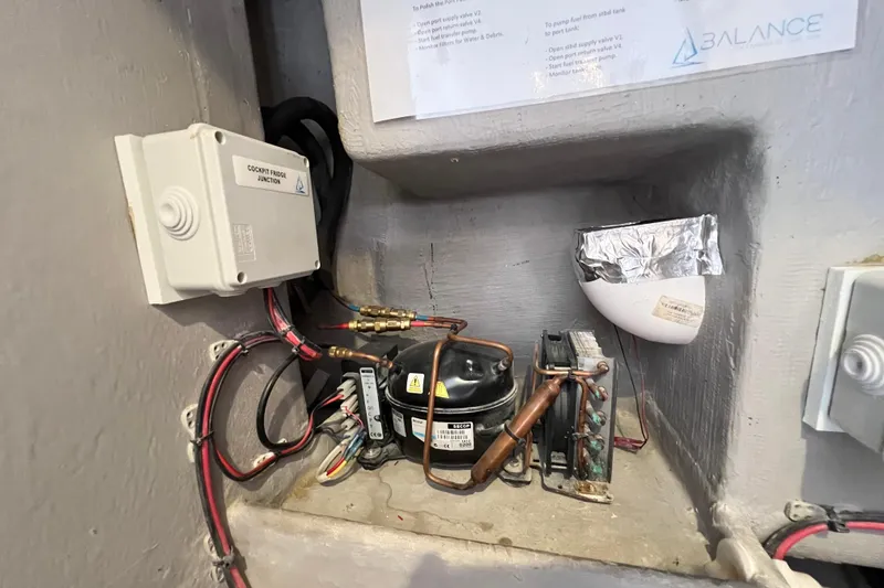 Slide: The Image of Electrical panel with labeled switches and cables in a Balance 482, 2021 model. - 101