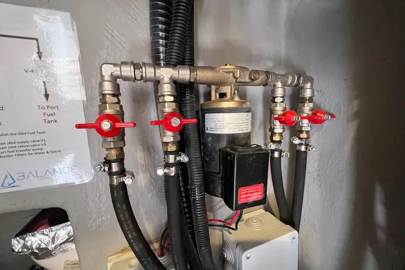 Slide: The Image of Electrical panel and inverter setup in a Balance 482, 2021 model, with wood paneling. - 102