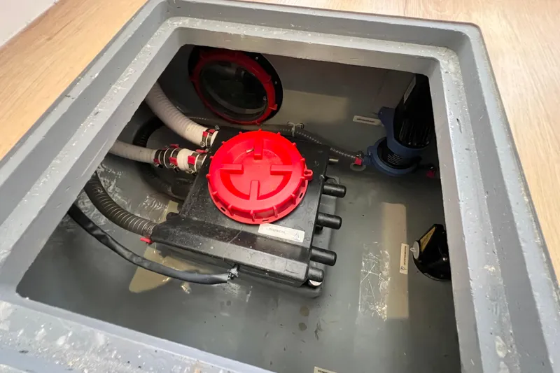 Slide: The Image of Water filtration system inside a Balance 482 model, 2021, with various components and wiring. - 104