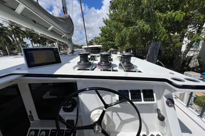 Slide: The Image of Storage cabinet in Balance 482 yacht, featuring organized supplies and a sleek black shower fixture. - 111