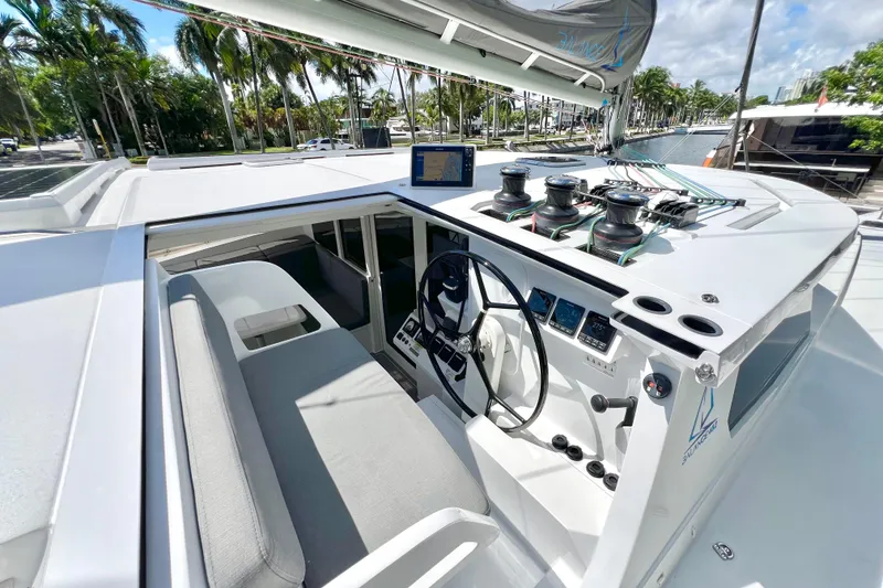 Slide: The Image of Control panel with dual Yanmar RPM gauges, caution labels, and engine controls on a Balance 482, 2021. - 112