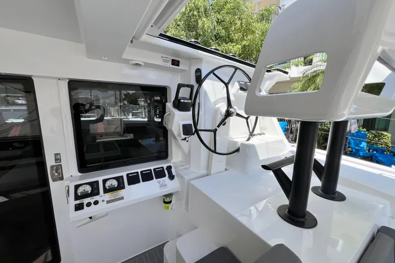 Slide: The Image of Sailing yacht Balance 482, 2021 model, with navigation display, docked near palm trees. - 114