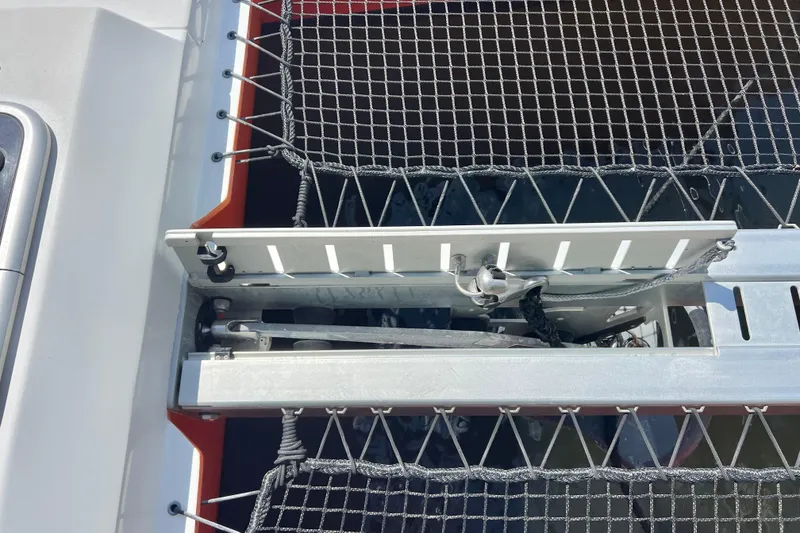 Slide: The Image of Sailboat mast with rigging, Balance 482 model, 2021, against a blue sky and trees. - 122