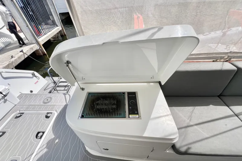 Slide: The Image of Sailboat with solar panels on deck, Balance 482 model, cruising a canal lined with palm trees. - 137