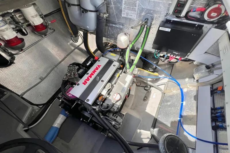 Slide: The Image of Engine room of a 2021 Balance 482 with Yanmar engine and electrical components. - 144