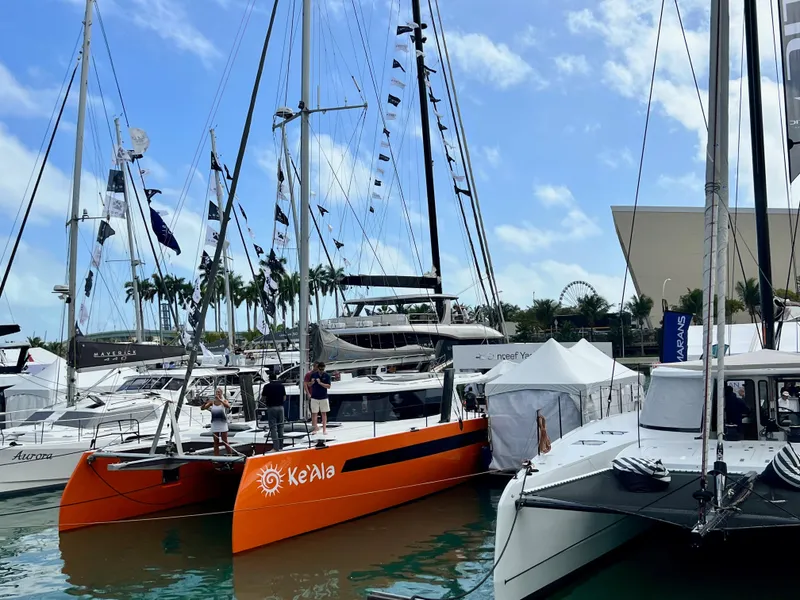 Slide: The Image of Catamaran Balance 482, 2021 model, docked with inflatable boat on davits. - 151