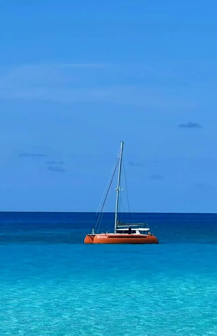 Slide: The Image of Inflatable boat with motor docked beside a Balance 482 catamaran, 2021 model. - 153