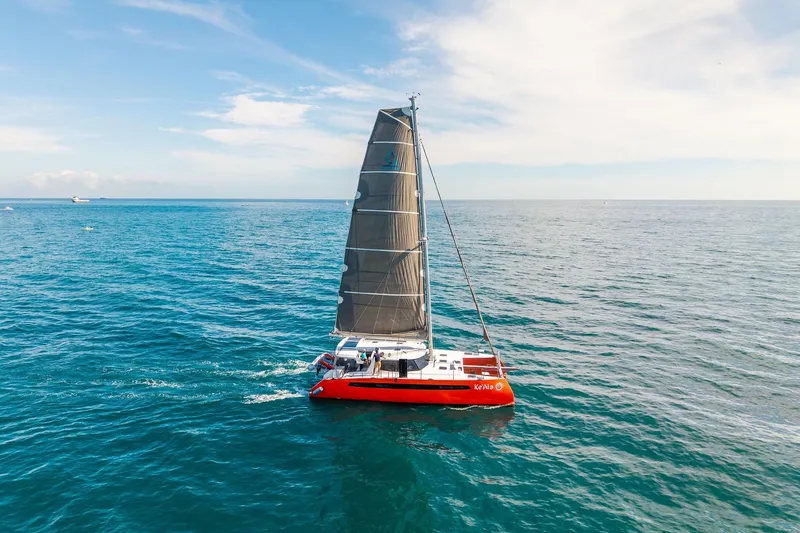 Slide: The Image of Red Balance 482 catamaran sailing on open sea, 2021 model. - 160