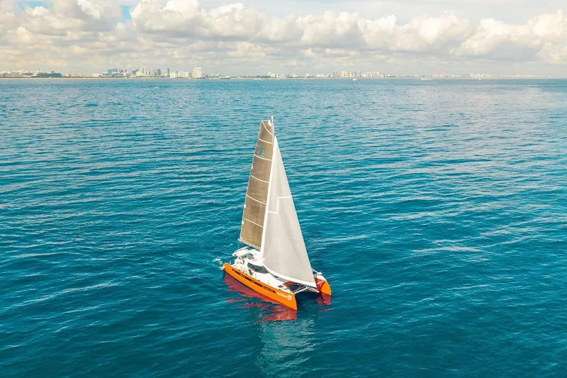 Slide: The Image of Sailboat Balance 482, 2021 model, cruising on calm ocean waters under a cloudy sky. - 163