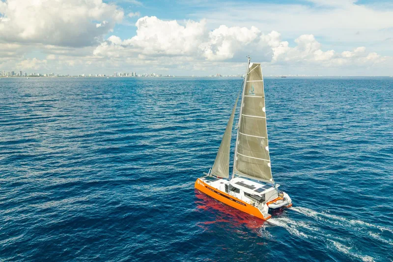 Slide: The Image of Sailing catamaran Balance 482, 2021 model, cruising on open ocean under clear skies. - 166