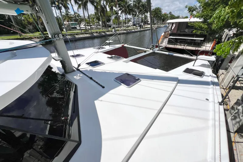 Slide: The Image of Sleek 2021 Balance 482 catamaran docked, featuring solar panels and modern design. - 17