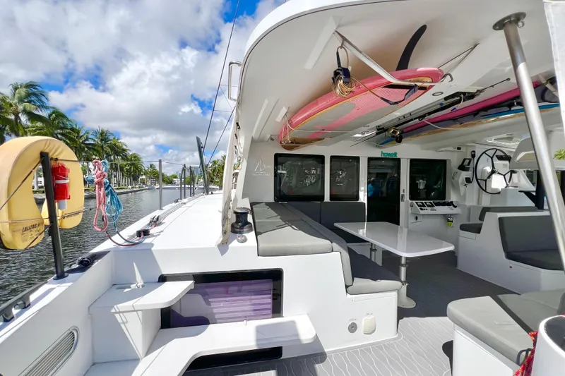 Slide: The Image of Sailing yacht Balance 482, 2021 model, docked near lush greenery and clear skies. - 19