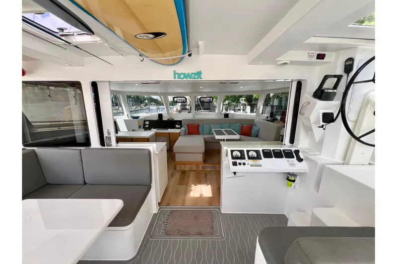 Slide: The Image of Modern Balance 482 yacht interior with gray seating and sleek white table, 2021 model. - 32