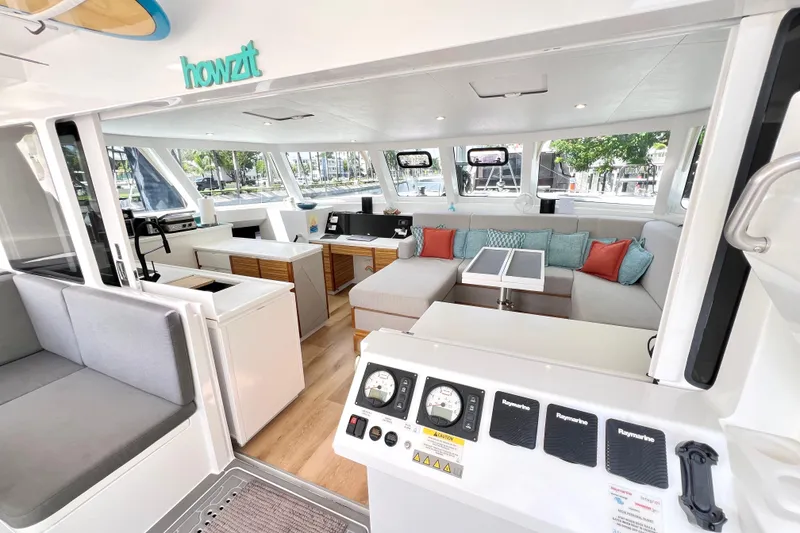 Slide: The Image of Spacious seating area on 2021 Balance 482 yacht with surfboards overhead. - 33