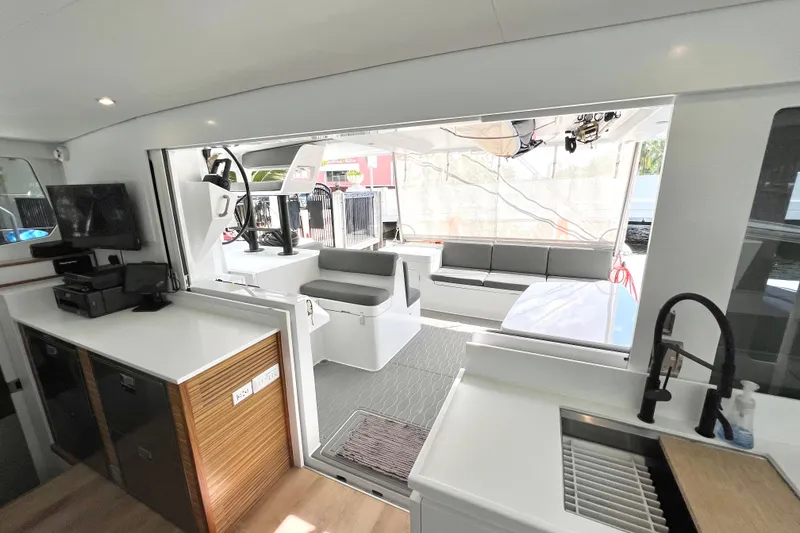 Slide: The Image of Luxurious interior of 2021 Balance 482 catamaran with modern seating and navigation controls. - 38