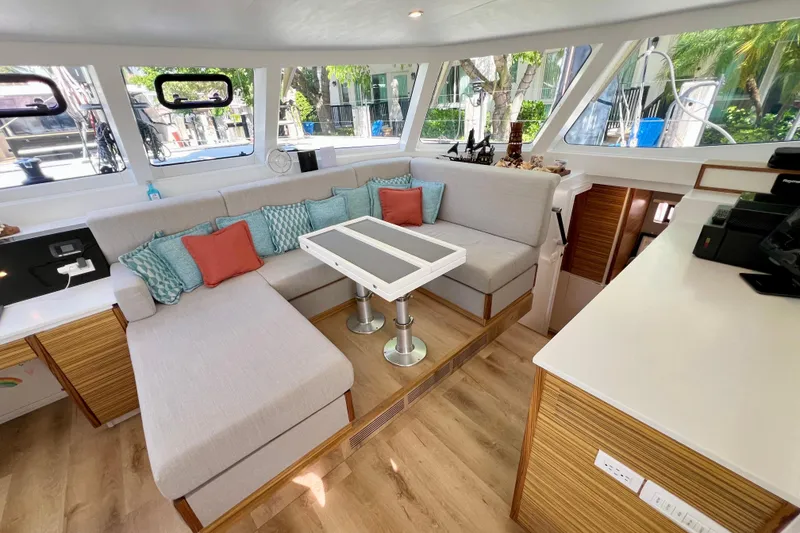 Slide: The Image of Interior of 2021 Balance 482 catamaran with modern seating and steering wheel. - 41