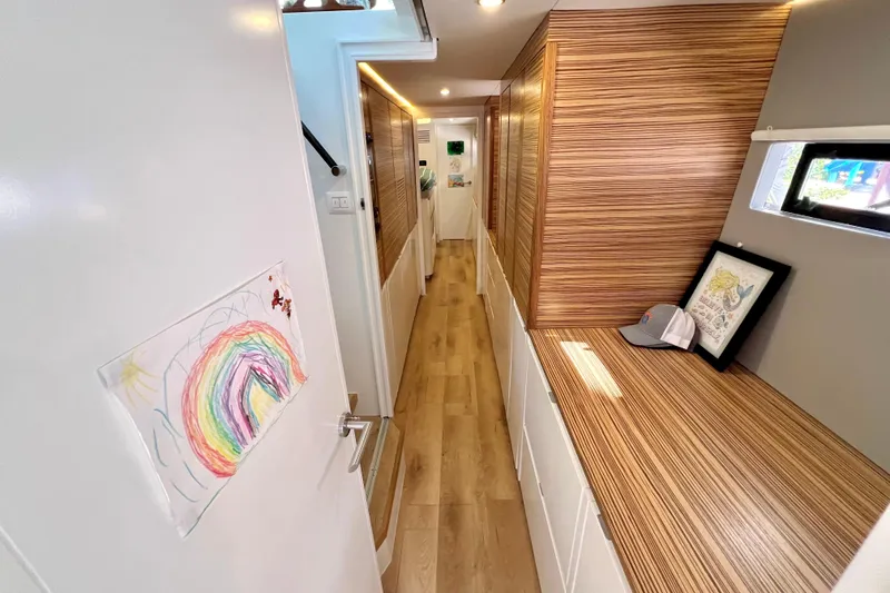 Slide: The Image of Modern yacht interior with wooden finishes, compact bathroom, and stainless steel appliances. Balance 482, 2021 model. - 64