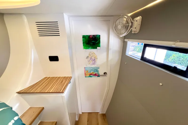 Slide: The Image of Modern interior of 2021 Balance 482 yacht with sleek wood paneling and ambient lighting. - 70