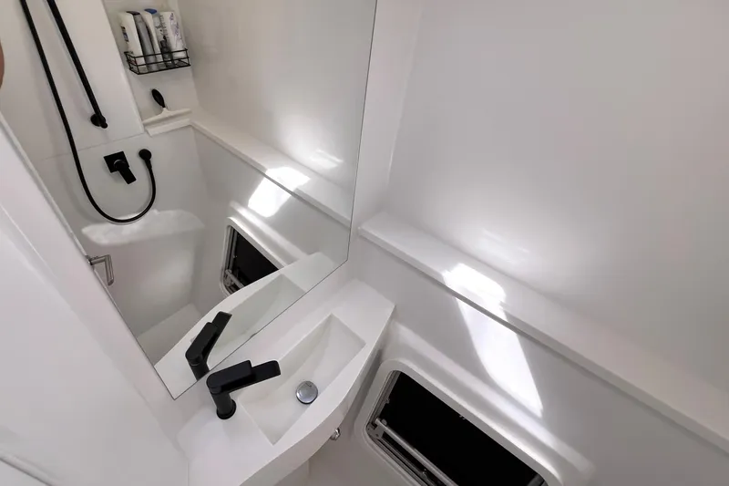 Slide: The Image of Cozy camper bedroom with plush toys, colorful blanket, and wooden cabinets in Balance 482 model. - 83