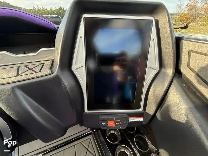Slide: The Image of 2022 Tigé Z3 boat dashboard with touchscreen display and control buttons. - 12