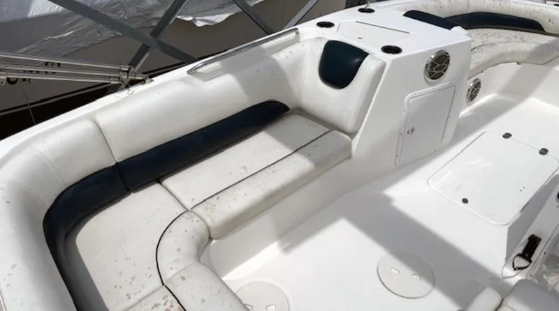 Slide: The Image of 2015 Hurricane SunDeck Sport 188 OB boat interior with white and navy seating. - 12