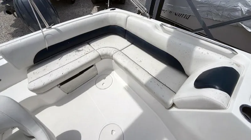 Slide: The Image of 2015 Hurricane SunDeck Sport 188 OB boat interior with white and navy seating. - 13