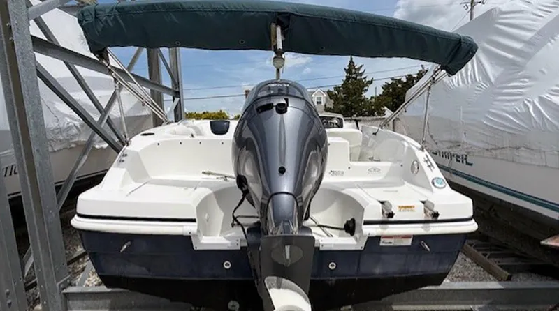 Slide: The Image of 2015 Hurricane SunDeck Sport 188 OB boat with outboard motor and canopy. - 3
