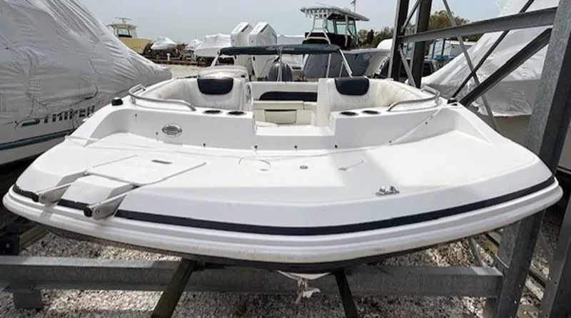 Slide: The Image of 2015 Hurricane SunDeck Sport 188 OB boat on display in a marina. - 6