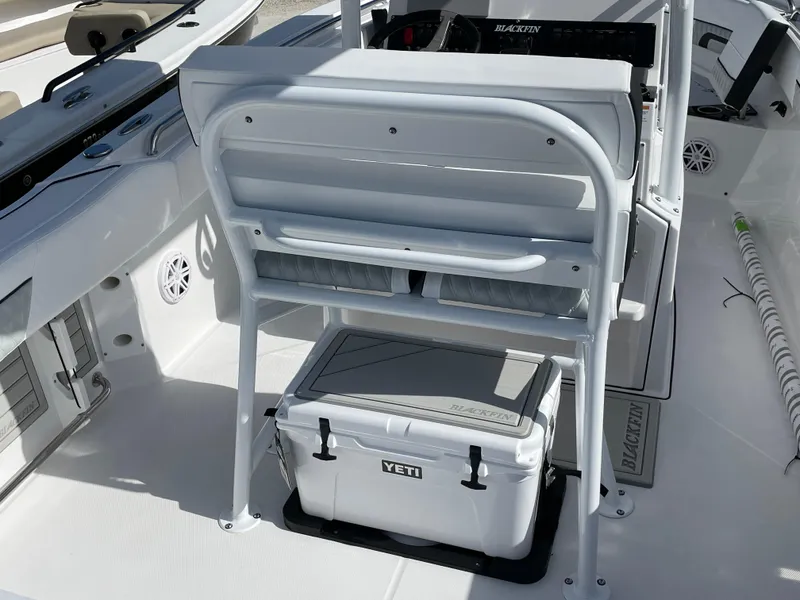 Slide: The Image of 2025 Blackfin 222CC boat interior with Yeti cooler and seating arrangement. - 17
