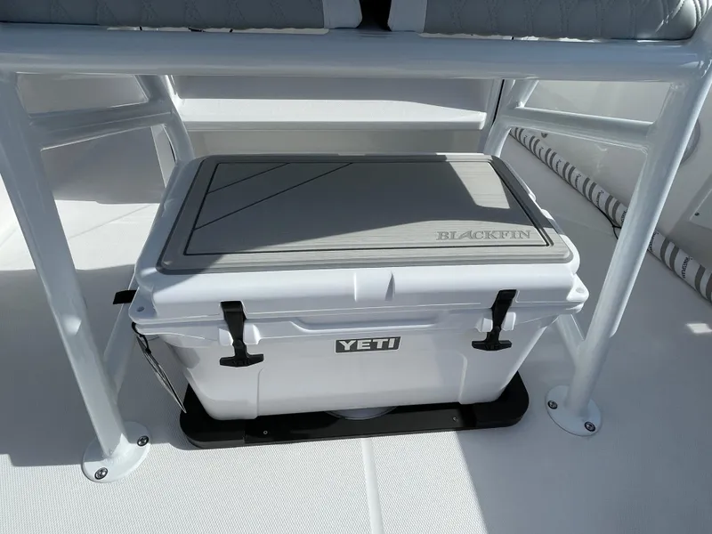 Slide: The Image of 2025 Blackfin 222CC boat with Yeti cooler under seat. - 18
