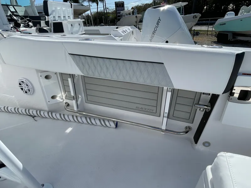 Slide: The Image of 2025 Blackfin 222CC boat interior with sleek seating and storage features. - 20