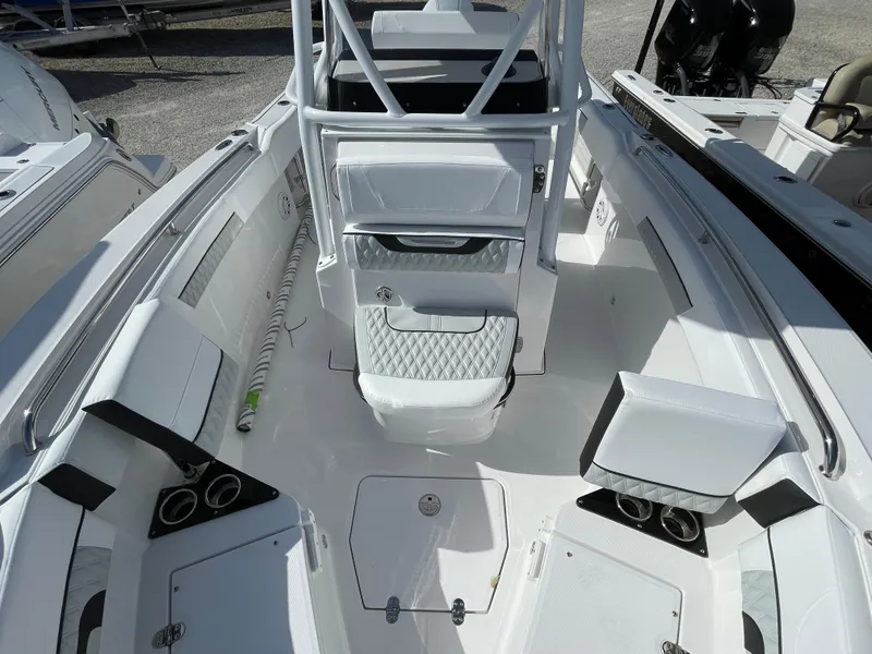 Slide: The Image of 2025 Blackfin 222CC boat interior with white seating and modern design. - 9