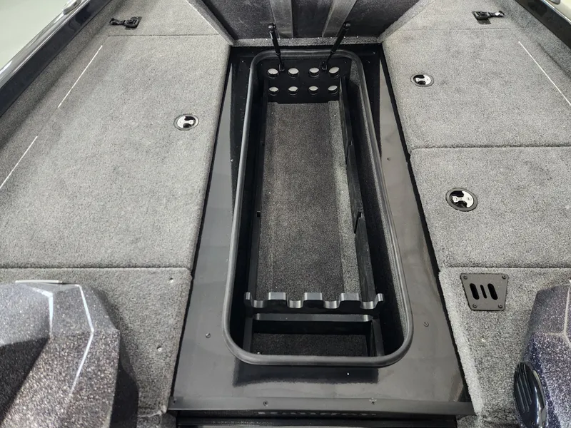 Slide: The Image of 2025 Ranger RT198P boat interior with rod storage compartment and carpeted deck. - 10