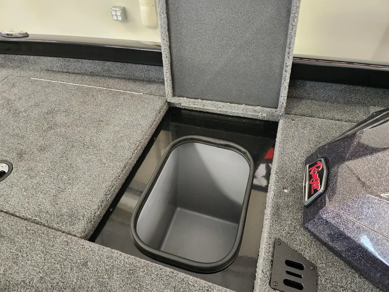 Slide: The Image of 2025 Ranger RT198P boat storage compartment with open lid, showcasing interior space. - 14