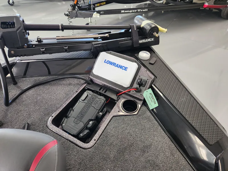 Slide: The Image of 2025 Ranger RT198P boat dashboard with Lowrance electronics and storage compartment. - 15
