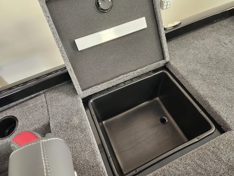 Slide: The Image of 2025 Ranger RT198P boat storage compartment with open lid, showcasing interior space. - 17