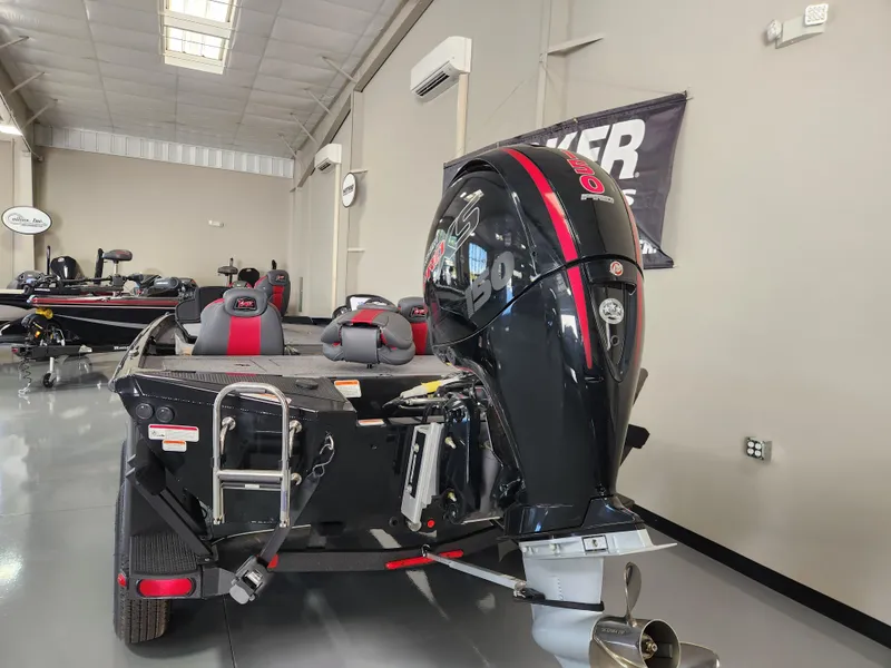 Slide: The Image of 2025 Ranger RT198P boat with powerful outboard motor in showroom setting. - 3