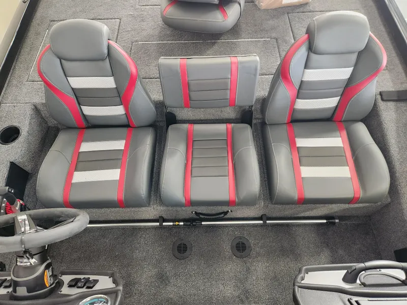 Slide: The Image of 2025 Ranger RT198P boat interior with three gray and red seats, steering wheel visible. - 7