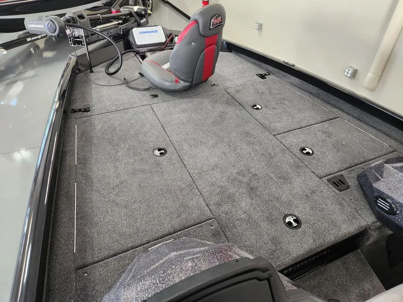 Slide: The Image of 2025 Ranger RT198P boat interior with carpeted deck and seating. - 9