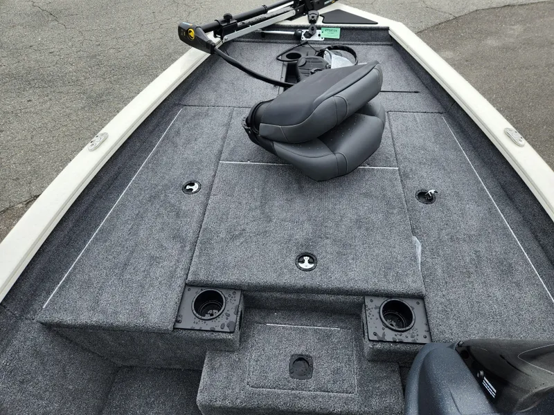 Slide: The Image of 2025 Tracker Pro Team 175 boat interior with gray carpet and seating. - 12