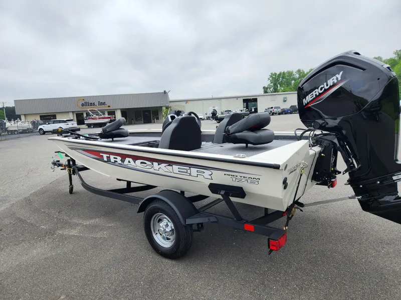 Slide: The Image of 2025 Tracker Pro Team 175 boat with Mercury engine on trailer in parking lot. - 4