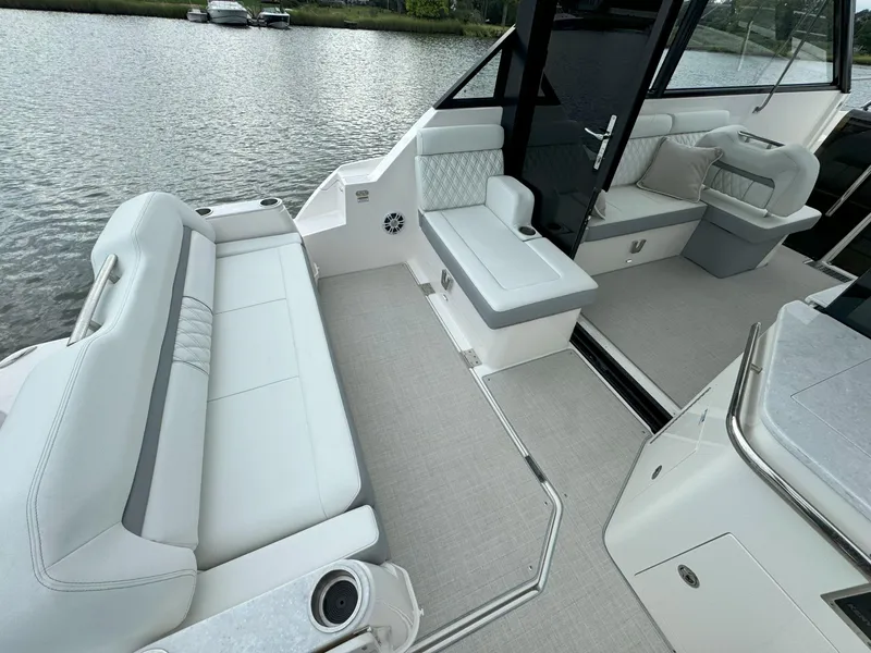 Slide: The Image of Luxurious interior of 2026 Regal 36 XO yacht with elegant seating and modern design. - 12
