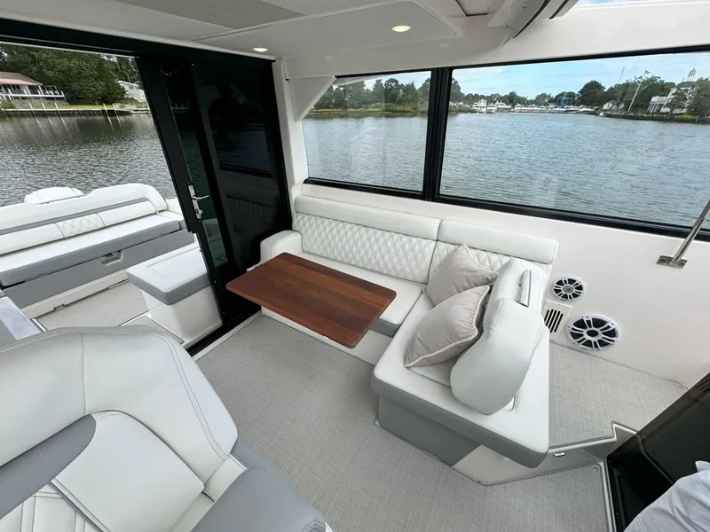 Slide: The Image of Luxurious interior of 2026 Regal 36 XO yacht with elegant seating and scenic water view. - 17